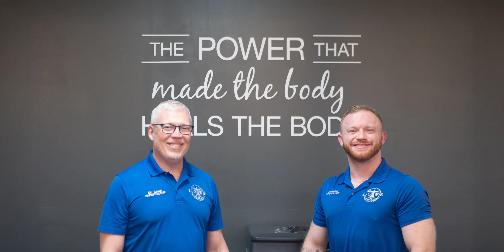 Patrick Lowe Smiling With Team